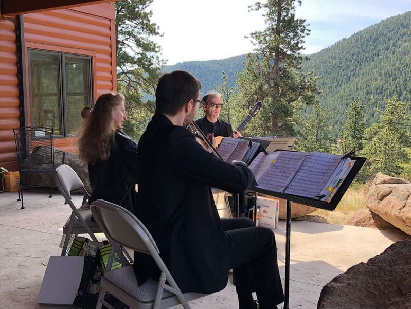 Lyric Ensemble trio performing live wedding music at an intimate wedding at Black Canyon Inn in Estes Park, CO.